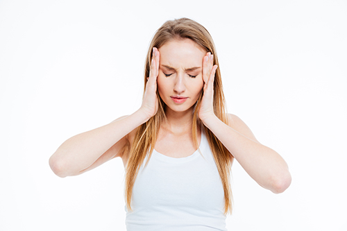 Sick woman having headache isolated on a white background