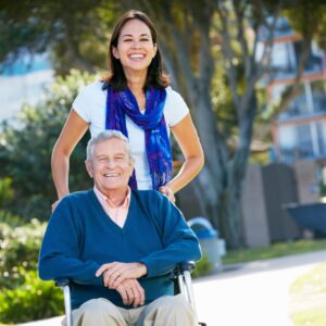 caregiver pushing a wheelchair