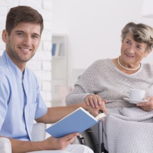 caregiver reading to woman