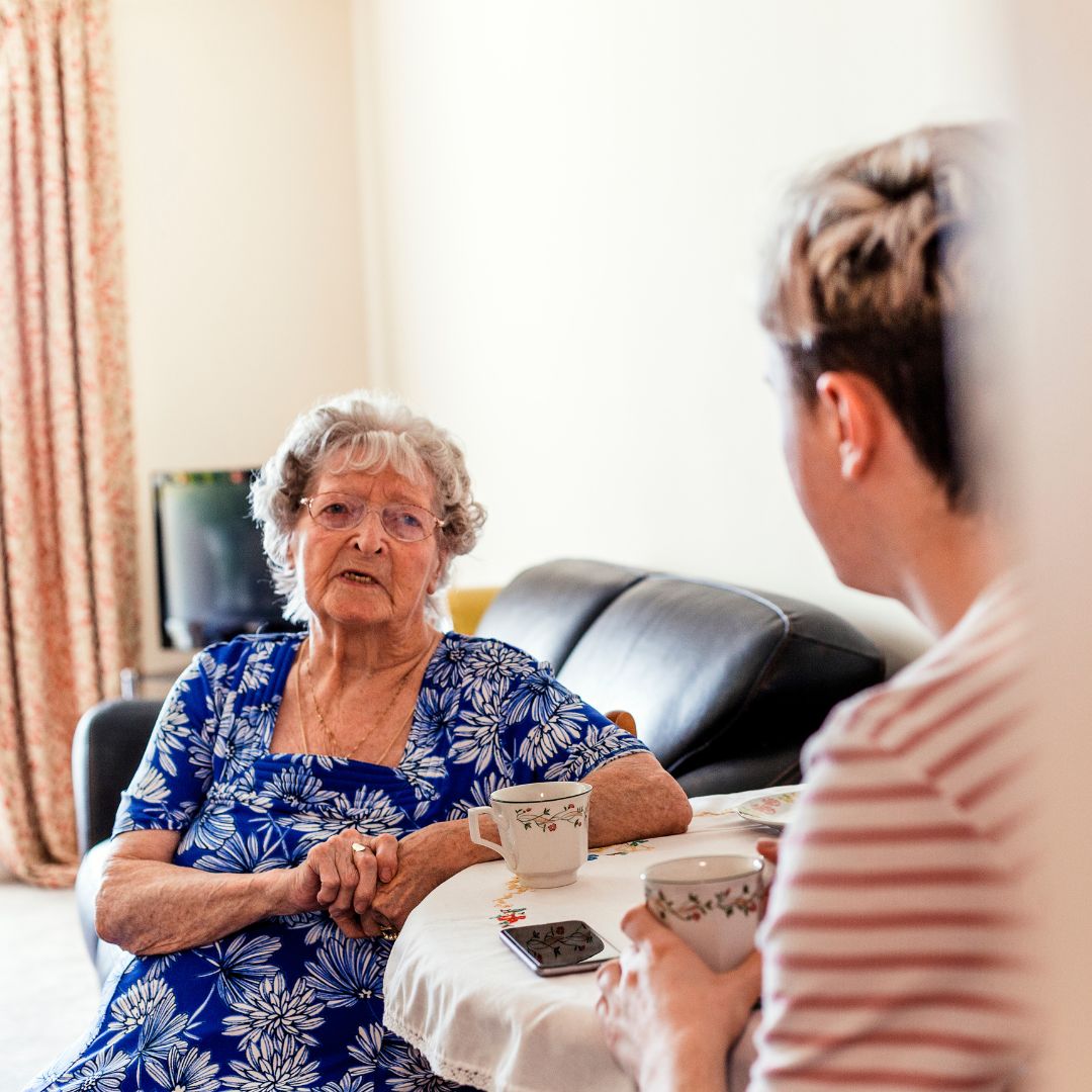 son talking with his elderly mother